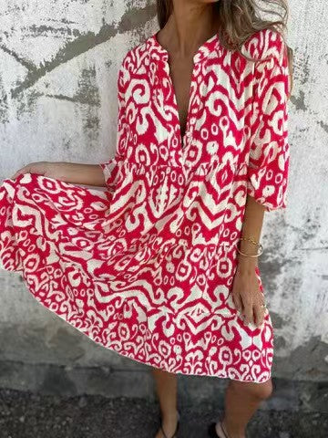 Vestido abotoado com decote em V, meia manga e estampado em linha A