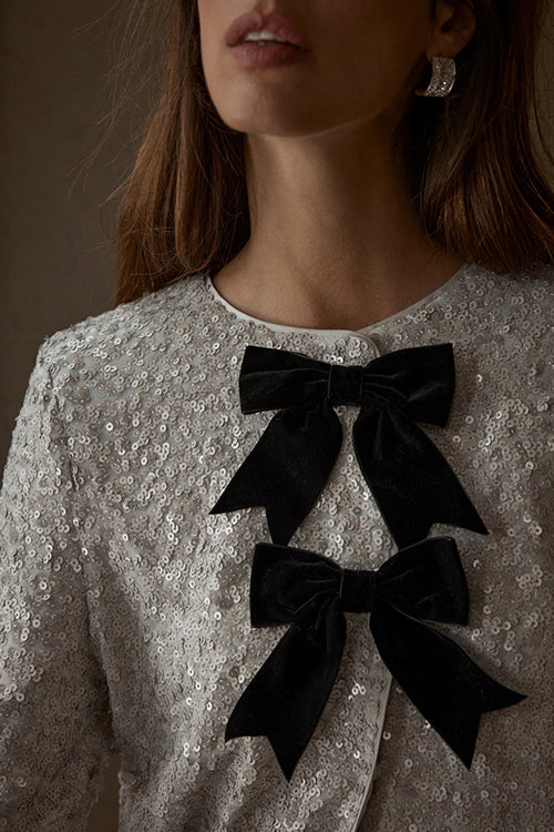 Elegante Jacke mit Glitzerpailletten und Schleife vorn