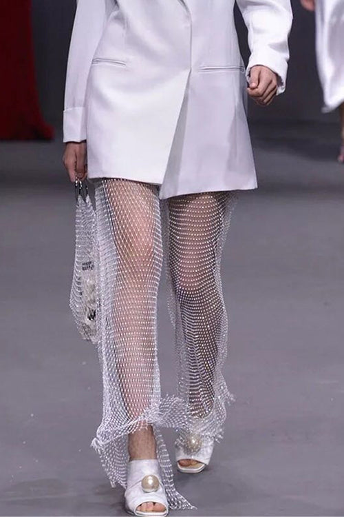 Pantalon en résille ajouré avec strass