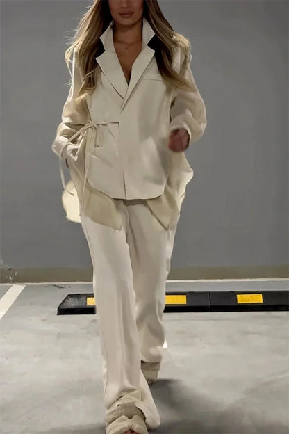 Ensemble veste à lacets irréguliers en mousseline de soie chic et élégant et pantalon droit à poches