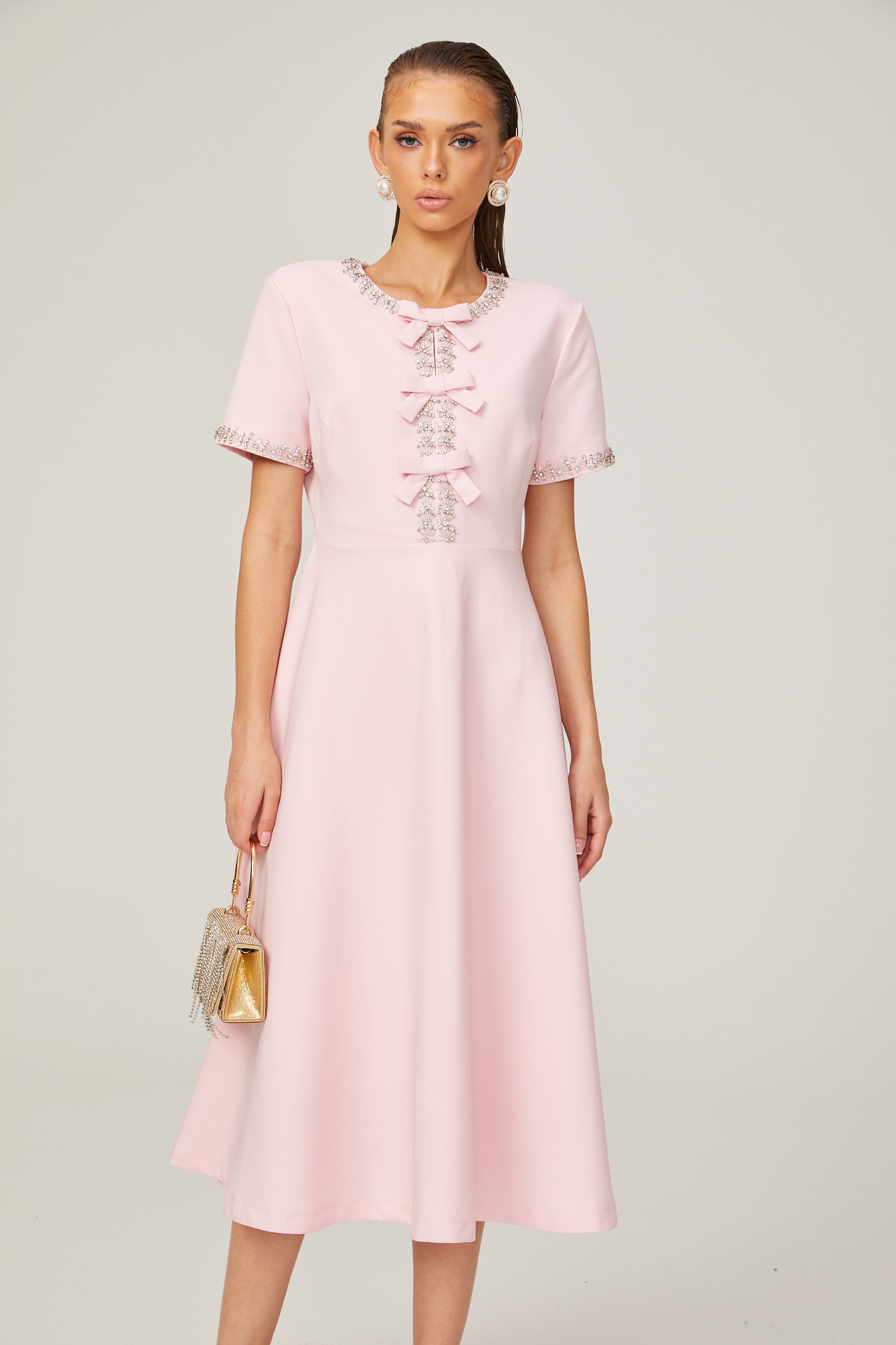 Cassi crystal-accented pink bow midi dress