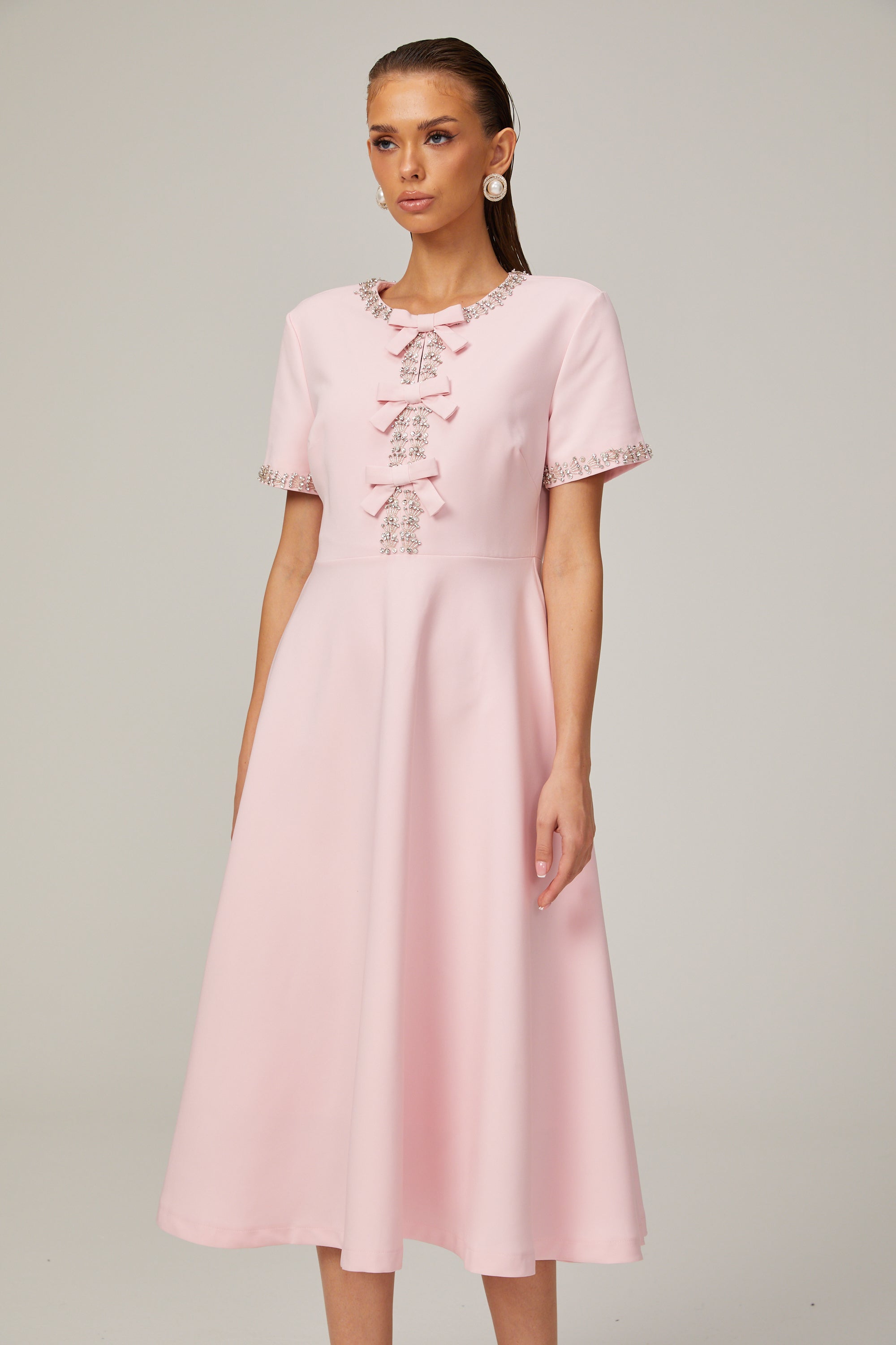 Cassi crystal-accented pink bow midi dress