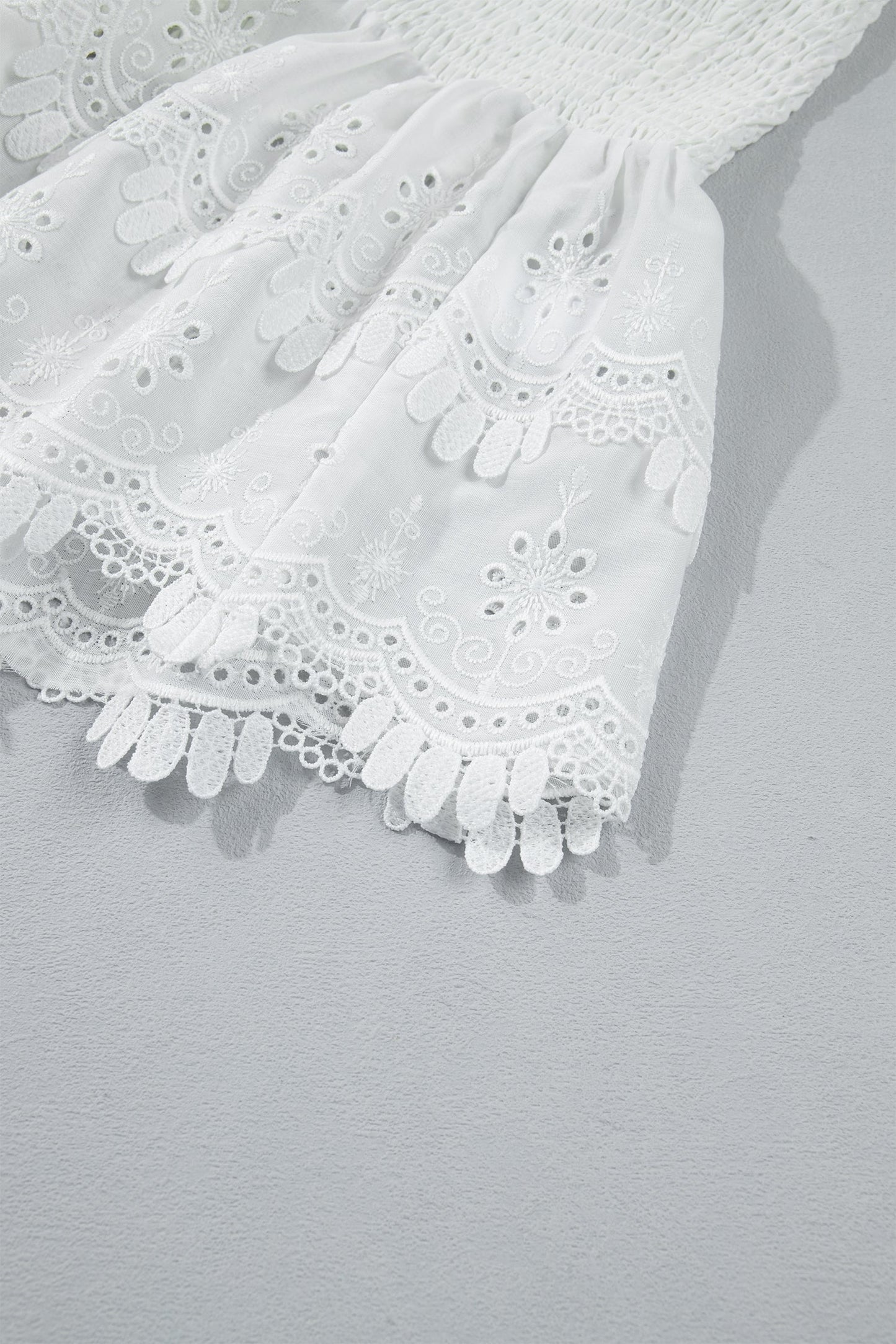 White Sleeveless Smocked Lace Peplum Top
