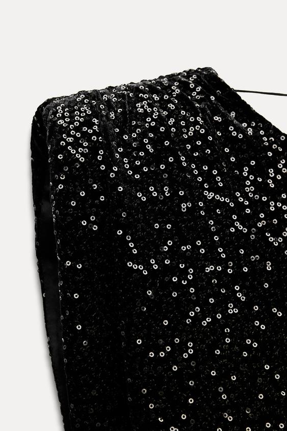 Mini-robe à paillettes et épaules rembourrées