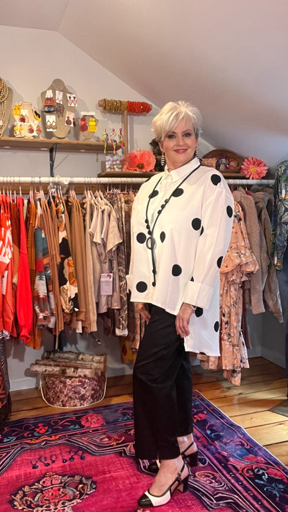 Polka Dot Perfection: Collared Button-Through Blouse with High-Low Hem