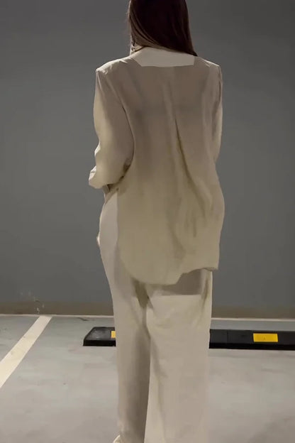 Ensemble veste à lacets irréguliers en mousseline de soie chic et élégant et pantalon droit à poches